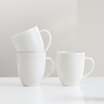 three arabia 24h white mugs on white table