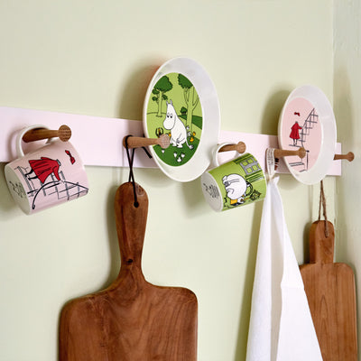Arabia Moomin dinnerware hanging on wall