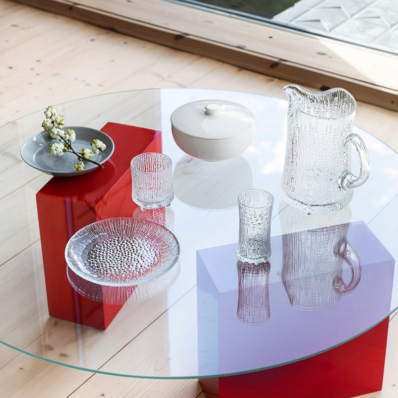 Ultima Thule glassware grouping reflecting onto glass tabletop