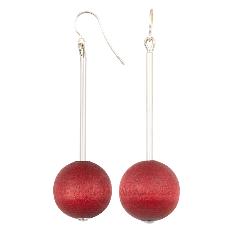 Red spherical earrings on a white background