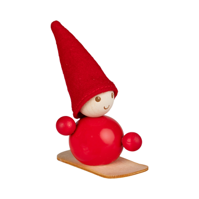 Red gnome figurine with a wooden base on a white background