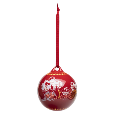 Red Christmas ornament with white designs on a white background