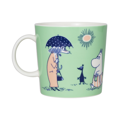 Moomin mug with illustrations of characters on a light green background