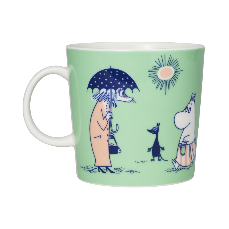 Moomin mug with illustrations of characters on a light green background