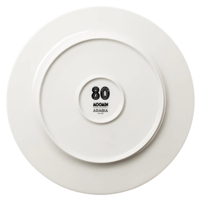 White plate with a Moomin Arabia logo on a white background