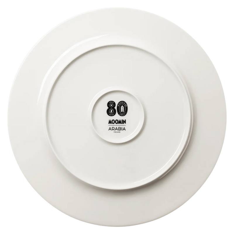 White plate with a Moomin Arabia logo on a white background