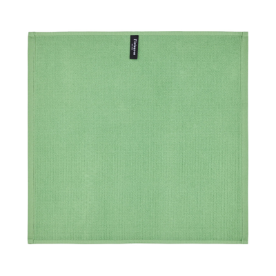 Green textured placemat with a brand label on a white background
