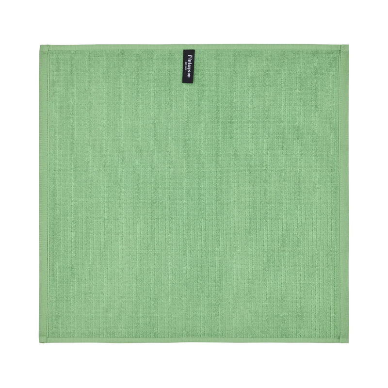 Green textured placemat with a brand label on a white background