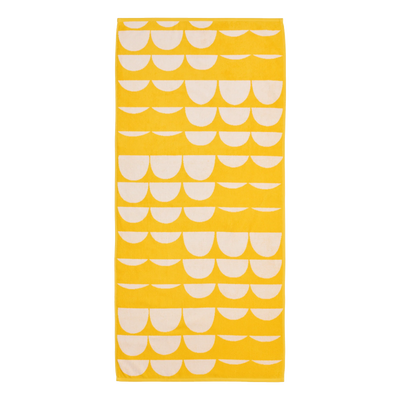 Yellow towel with white scalloped pattern on a white background