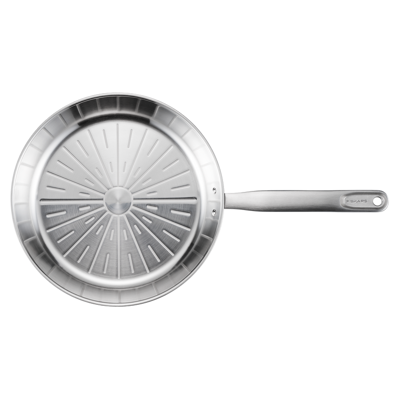 Stainless steel frying pan with a textured bottom on a white background