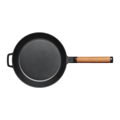 Black frying pan with a wooden handle on a white background