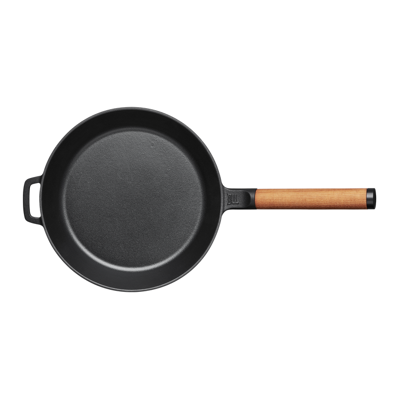 Black frying pan with a wooden handle on a white background