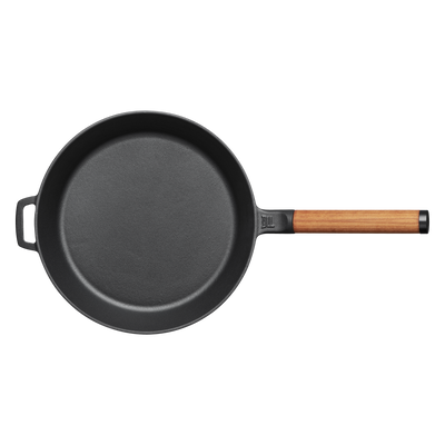 Black frying pan with a wooden handle on a white background