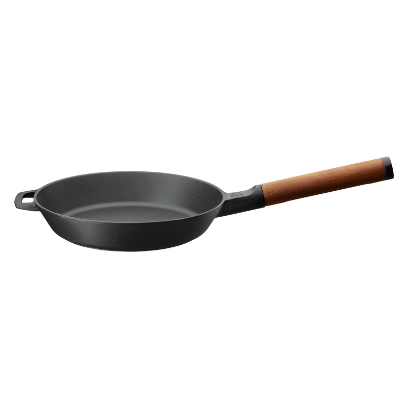Black frying pan with a wooden handle on a white background