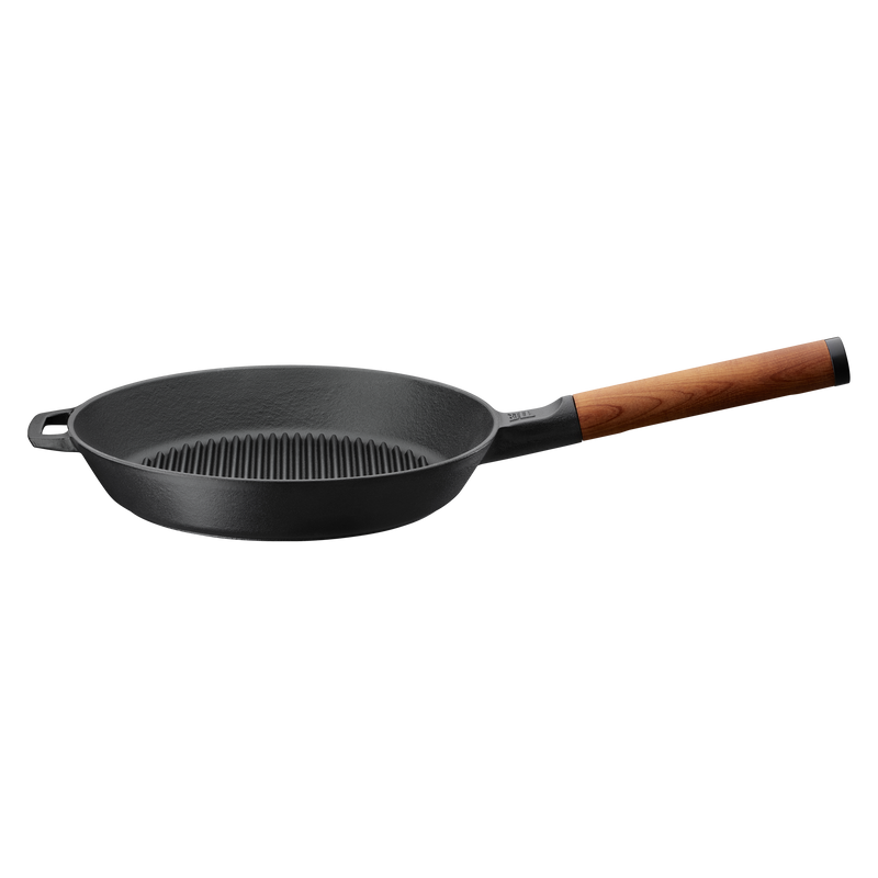 Black frying pan with a wooden handle on a white background