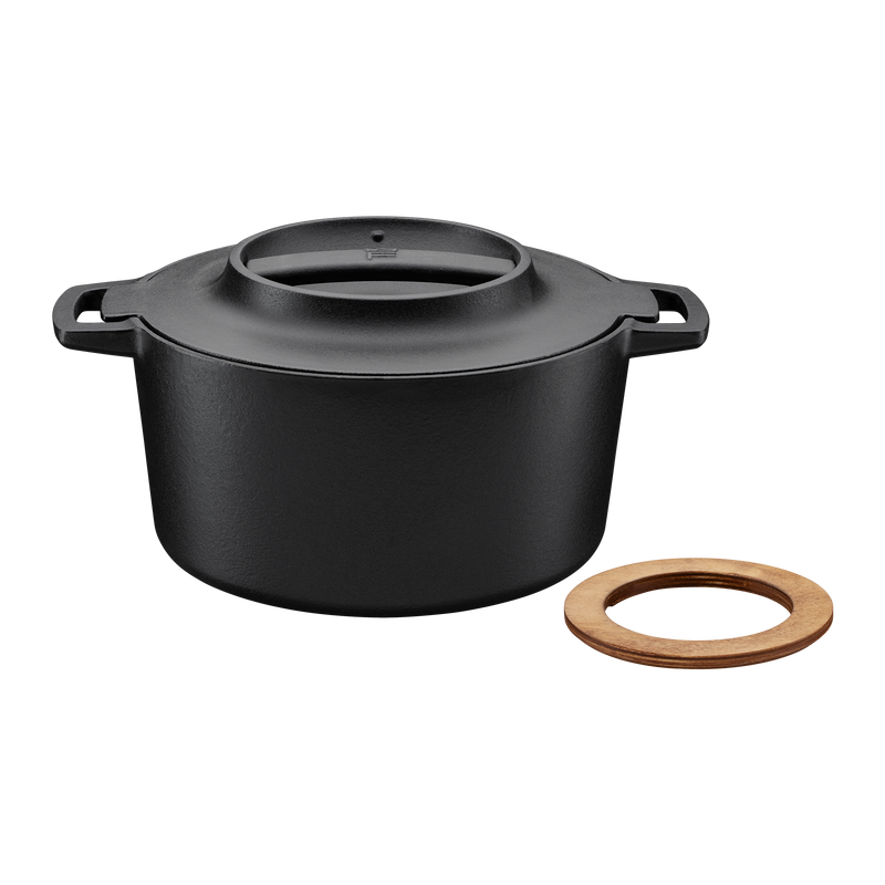 Black pot with a wooden ring on a white background