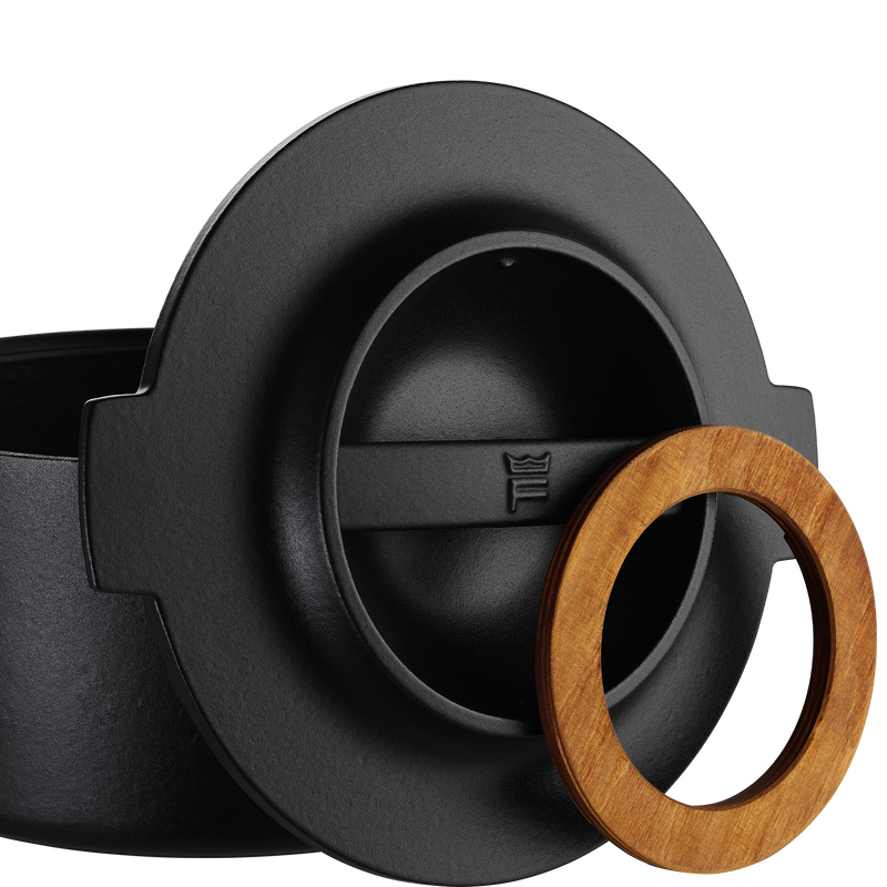 Black kitchen sink strainer with a wooden ring on a white background