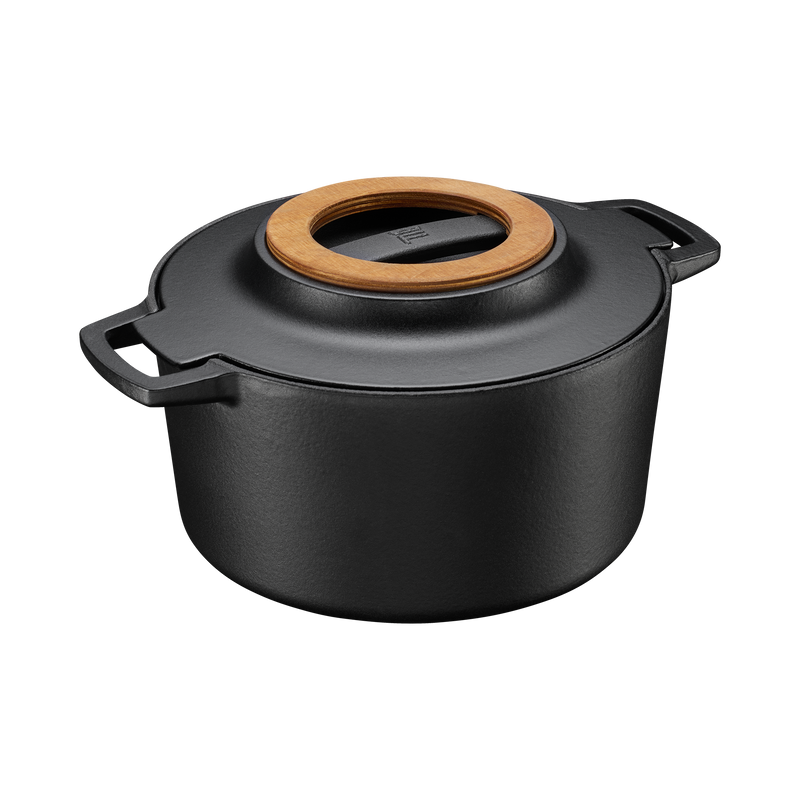 Black pot with a wooden lid on a white background