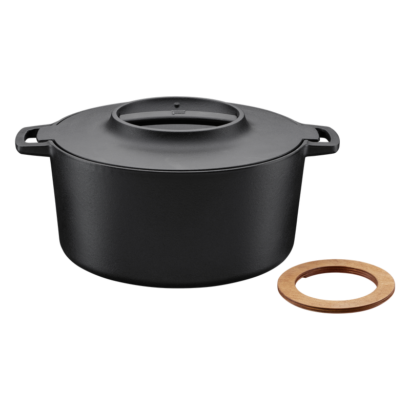 Black pot with a wooden ring on a white background