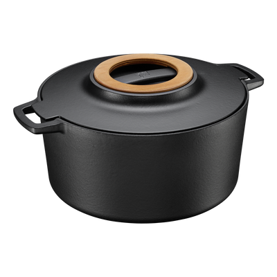 Black cast iron pot with wooden handle on a white background