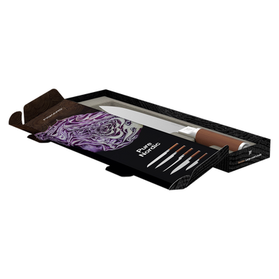 Set of knives with a decorative towel in an open black box on a white background