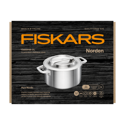 Fiskars Norden stainless steel casserole on a wooden-textured packaging background