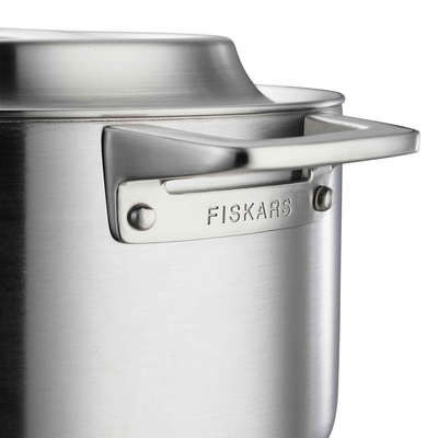Close-up of a Fiskars kitchen tool on a white background