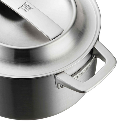 Stainless steel pot with lid featuring the Fissler brand on a white background