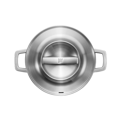 Stainless steel pot with a lid on a white background