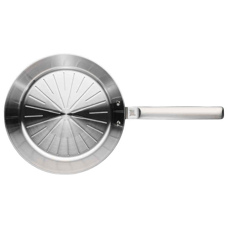 Stainless steel frying pan on a white background