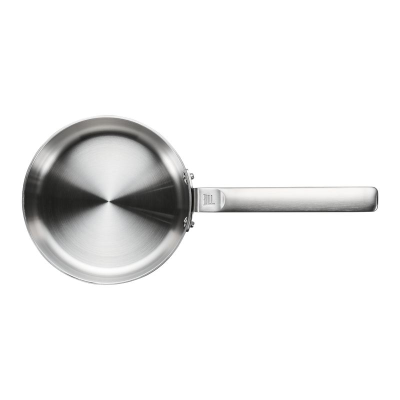 Stainless steel frying pan on a white background