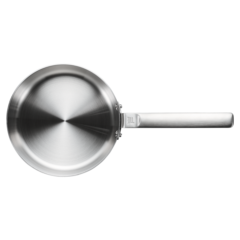 Stainless steel frying pan on a white background