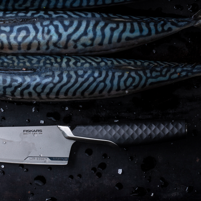 Fekars knife with a fish on a dark background