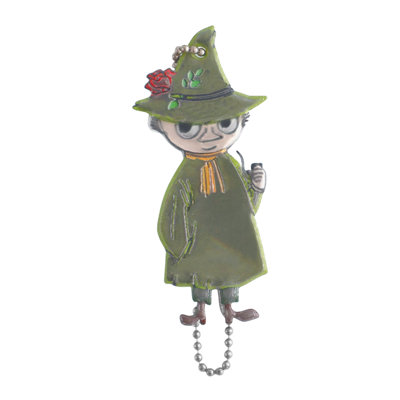 Decorative witch figurine with green hat and cloak on a white background