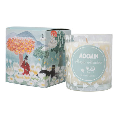 Moomin candle with packaging featuring illustrations of characters and nature.