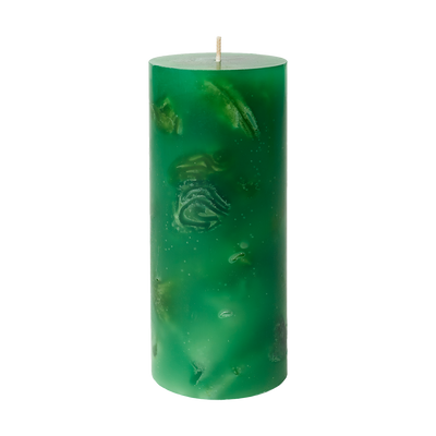 Green candle with embossed design on a white background