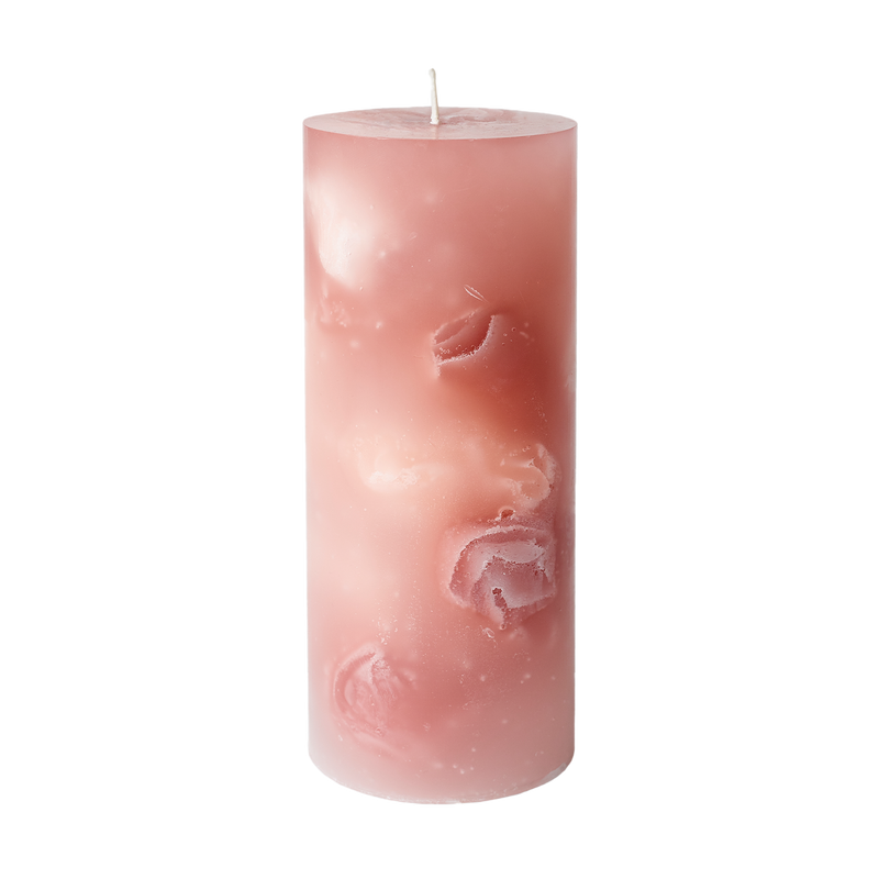 Pink candle with floral design on a white background