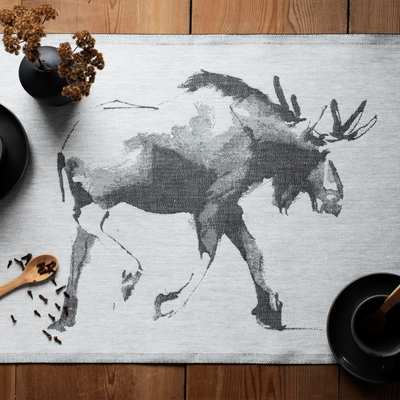 Placemat with moose design on a wooden table