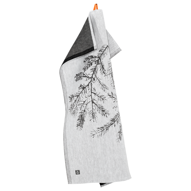 Gray towel with black leaf pattern hanging on a white background