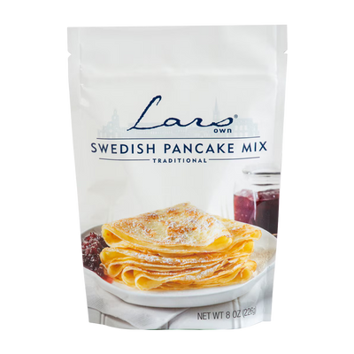 Lars' Own Swedish Pancake Mix packaging with a stack of pancakes and jam on a white background