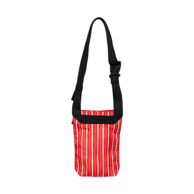 Red striped bag with a black strap on a white background