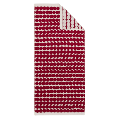 Red and white patterned towel on a white background