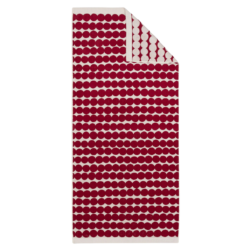 Red and white patterned towel on a white background
