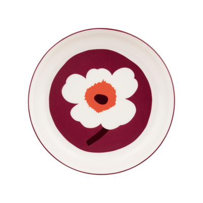 Round plate with a white flower design on a red background