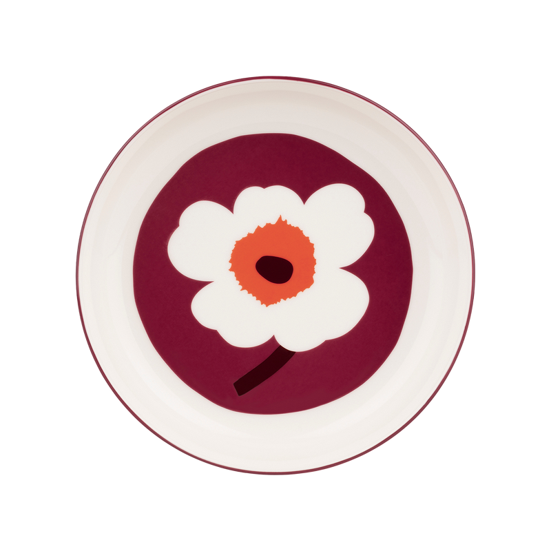 Round plate with a white flower design on a red background