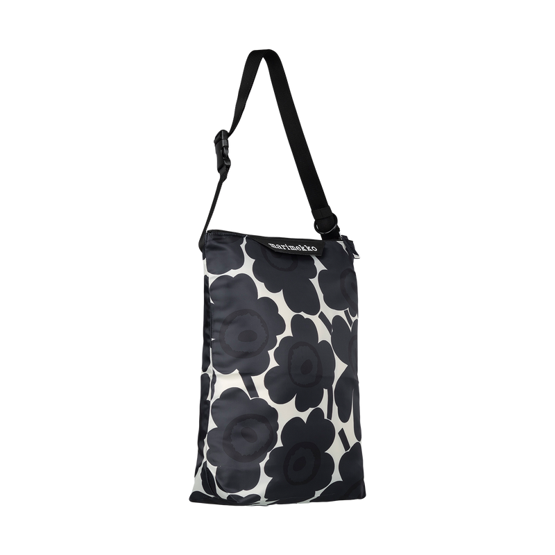 Black floral patterned bag with a strap on a white background