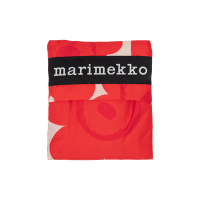 Marimekko fabric with red and white pattern on a white background