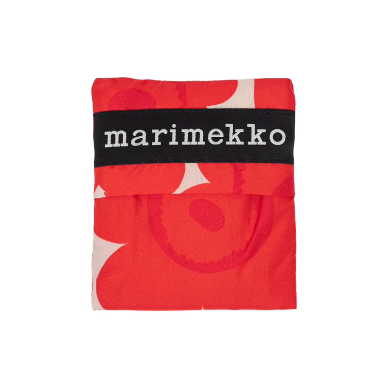 Marimekko fabric with red and white pattern on a white background