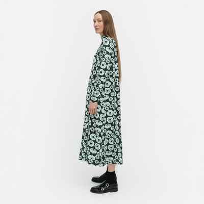 Woman wearing a floral dress on a white background