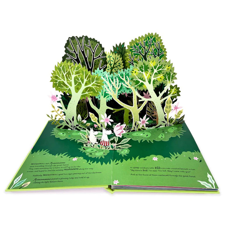 Pop-up book with a forest scene and animals on a white background